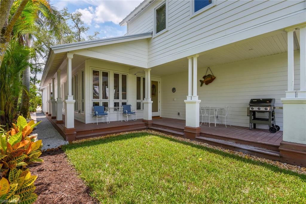 223 11th Avenue South Naples, FL 34102 - Photo 35 of 42 a view of a backyard with a backyard and porch
