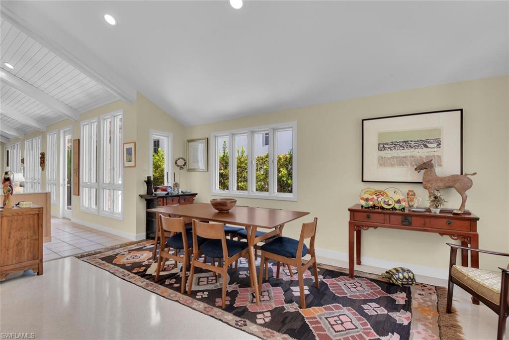 223 11th Avenue South Naples, FL 34102 - Photo 9 of 42 a view of a dining room with furniture and wooden floor