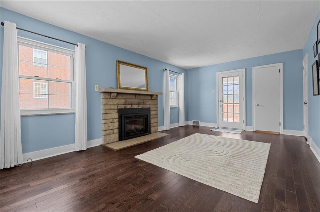 123 Crescent Hills Road Pittsburgh, PA 15235 - Photo 6 of 31 new wood floors 2024. stone fireplace (gas)