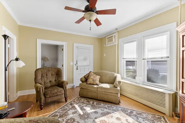 a living room with furniture and a window