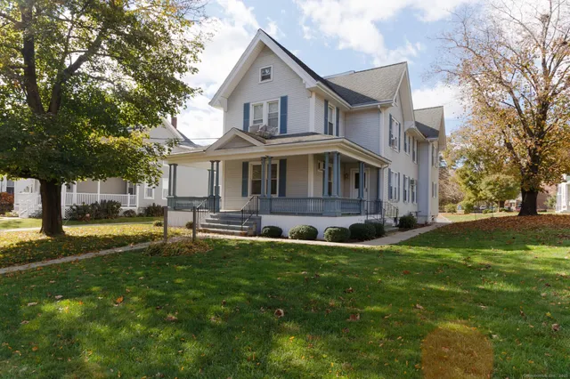 a front view of a house with a yard