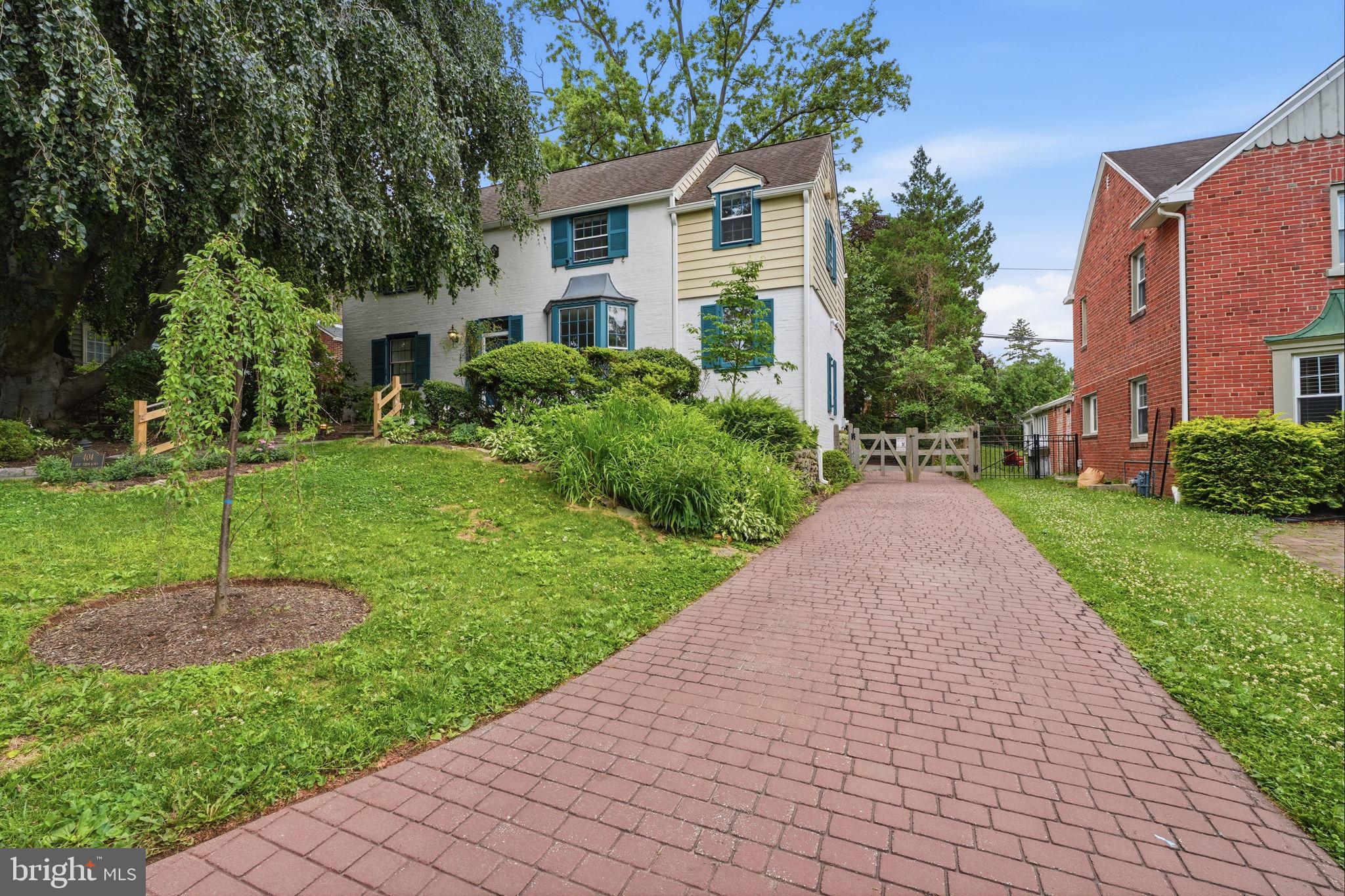 404 Old Farm Road Wyncote, PA 19095 - Photo 2 of 41 Charming home with lush greenery.