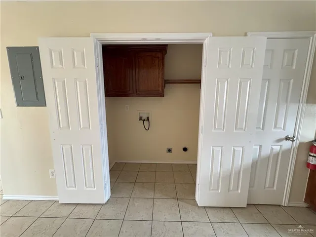 a view of a utility room with closet