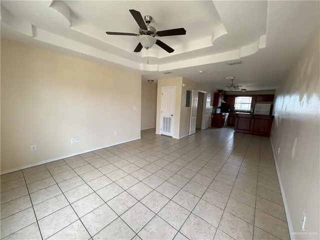 a view of a livingroom and a kitchen