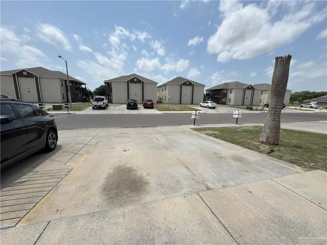 a view of a car parked in front of a building