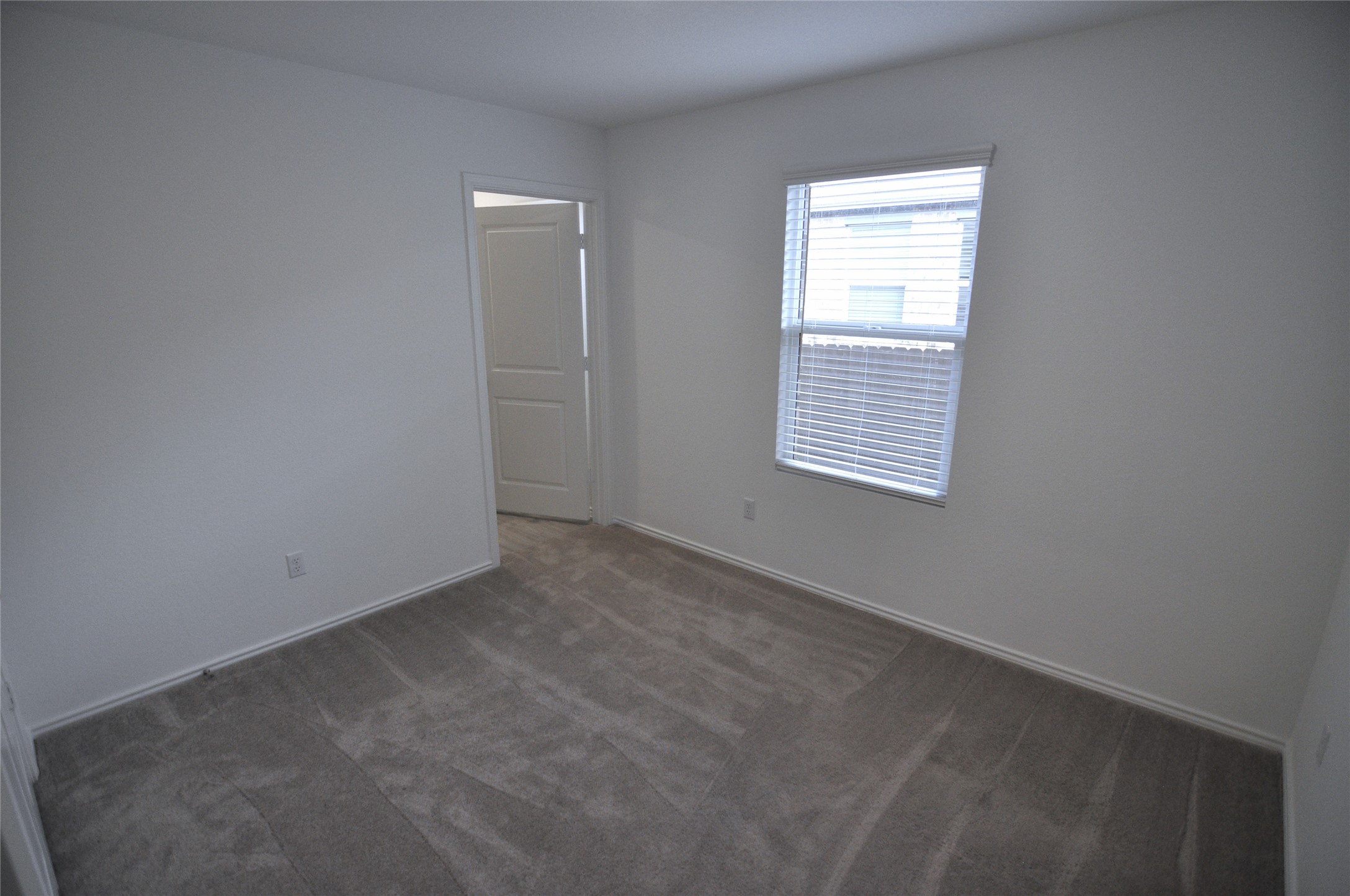1537 Chapel Ranch Road Georgetown, TX 78628 - Photo 13 of 25 Empty room with dark carpet and baseboards