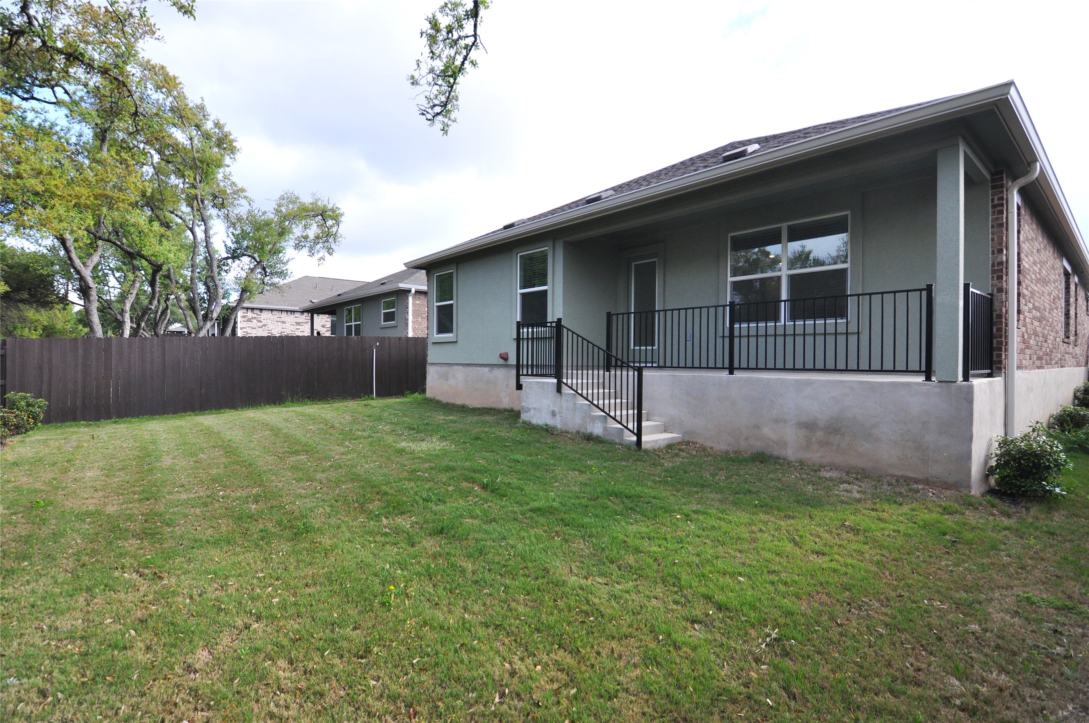 1537 Chapel Ranch Road Georgetown, TX 78628 - Photo 6 of 25 Rear view of house with a patio area and brick siding