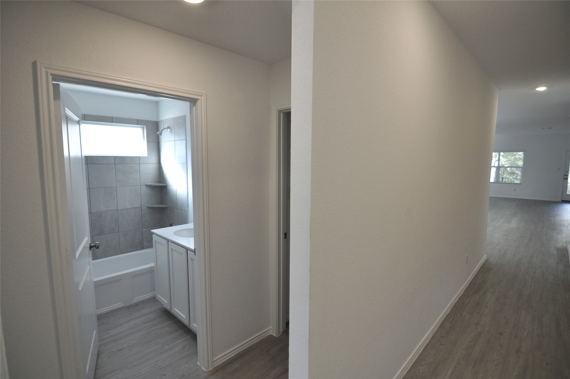 1537 Chapel Ranch Road Georgetown, TX 78628 - Photo 8 of 25 Hall with dark wood finished floors, healthy amount of natural light, and recessed lighting