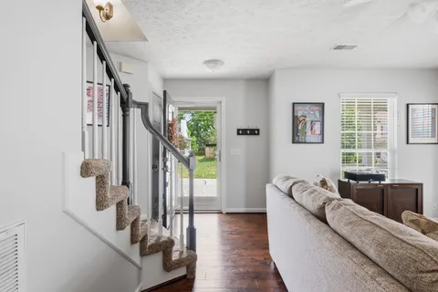 a living room with furniture and a large window