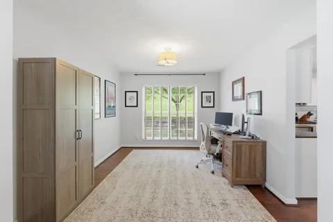 a workspace with furniture and a window