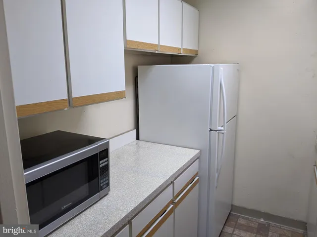 a kitchen with a stove and a microwave