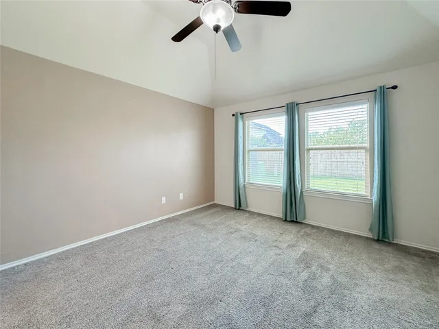 a spacious bathroom with a bathtub and a sink