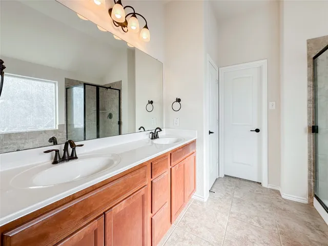 a bathroom with a sink toilet and mirror