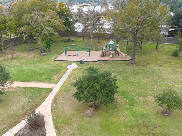 a view of a swimming pool with a yard