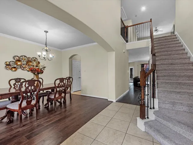 a view of a dining room with furniture and wooden floor