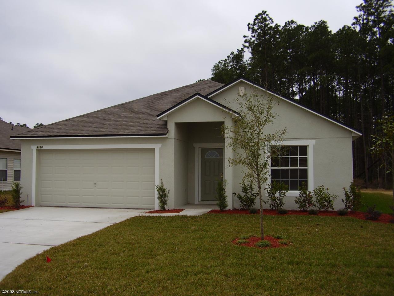 9164 Raptor Drive Jacksonville, FL 32221 - Photo 1 of 1 a front view of a house with garden