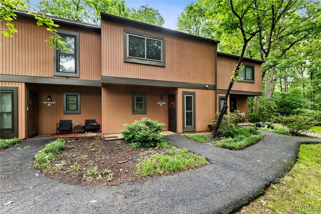 11719 South Briar Patch Drive Midlothian, VA 23113 - Photo 1 of 21 a front view of a house with garden