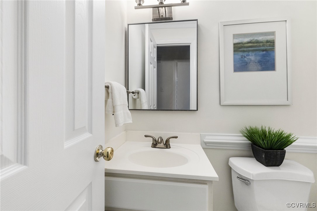 11719 South Briar Patch Drive Midlothian, VA 23113 - Photo 14 of 21 a bathroom with a toilet sink and mirror