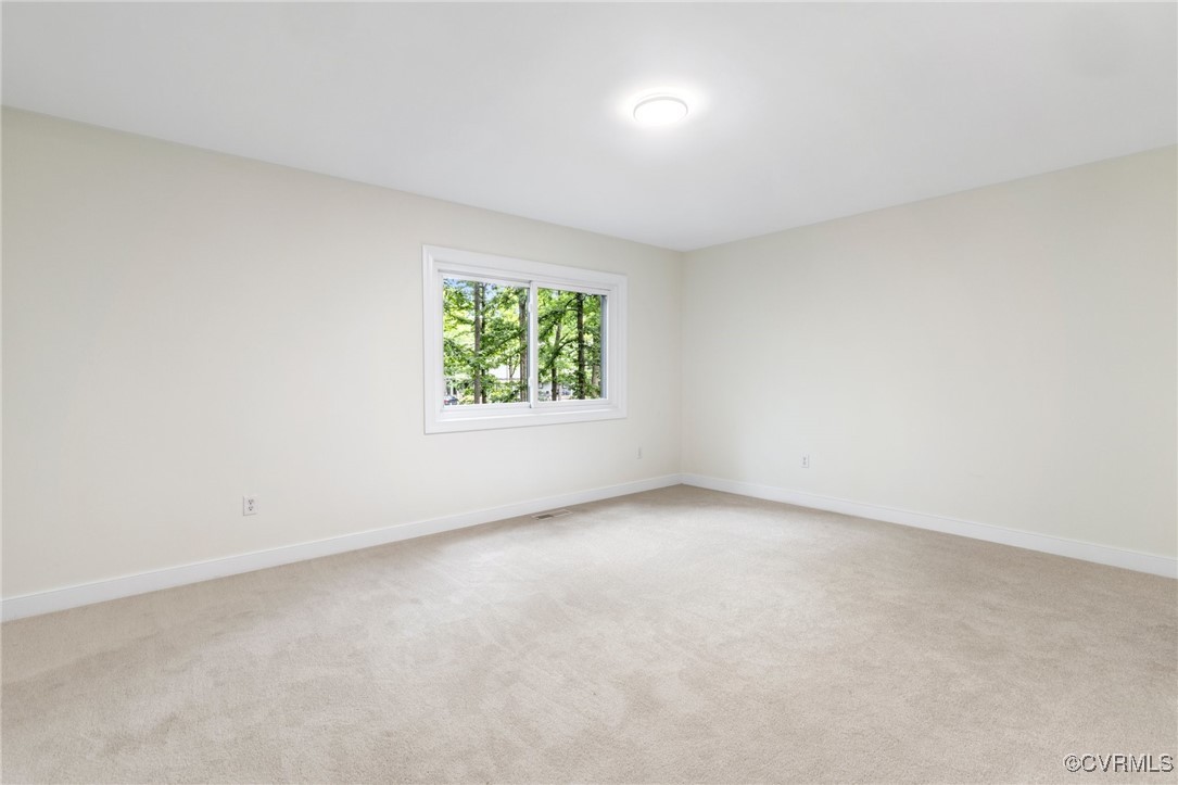 11719 South Briar Patch Drive Midlothian, VA 23113 - Photo 18 of 21 an empty room with windows
