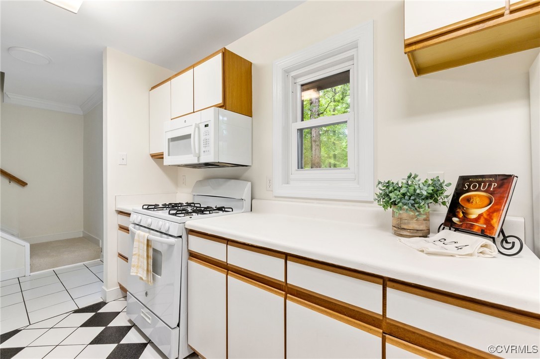 11719 South Briar Patch Drive Midlothian, VA 23113 - Photo 6 of 21 a kitchen with stainless steel appliances granite countertop a stove a sink and a microwave