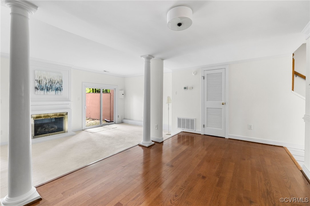 11719 South Briar Patch Drive Midlothian, VA 23113 - Photo 9 of 21 an empty room with wooden floor and a fireplace