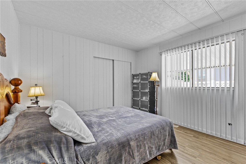 4000 Pierce Street, Unit 132 Riverside, CA 92505 - Photo 19 of 43 a bedroom with a bed and cabinets