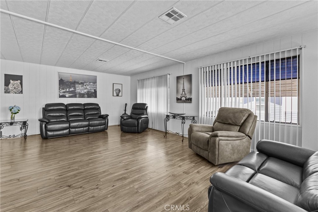 4000 Pierce Street, Unit 132 Riverside, CA 92505 - Photo 10 of 43 a living room with furniture and a large window