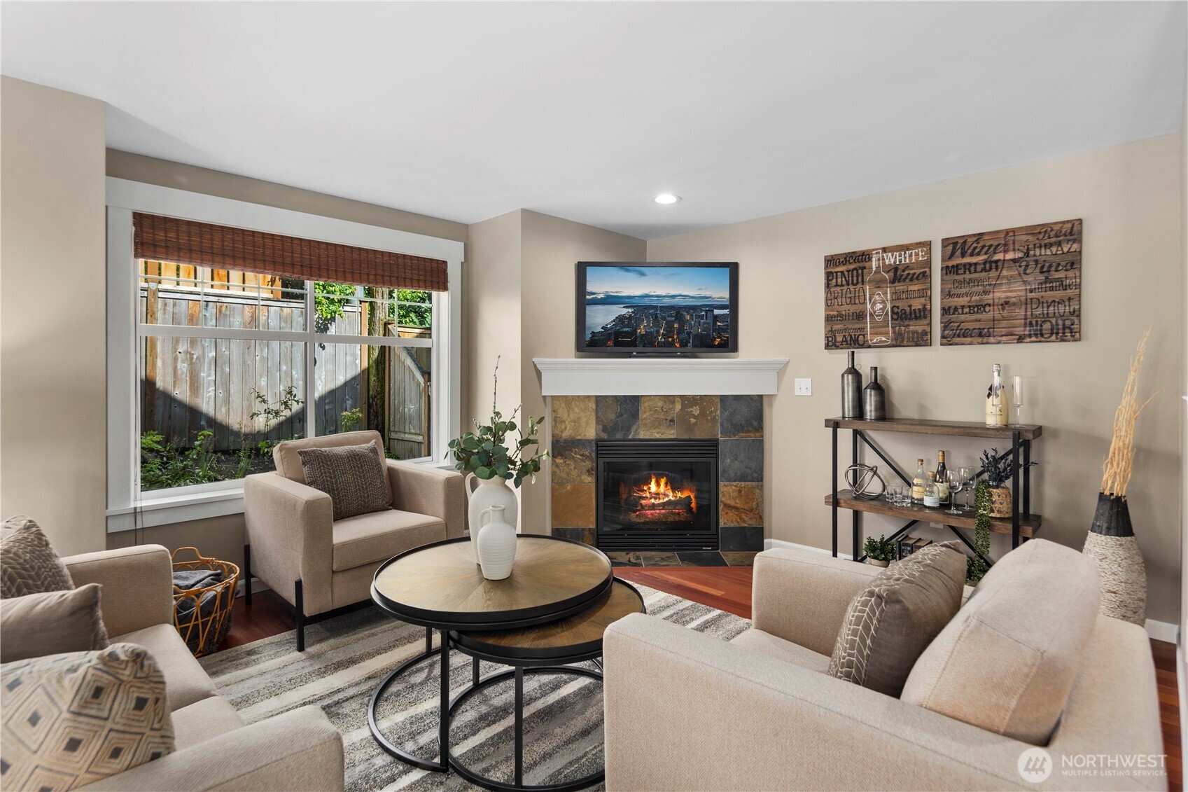 830 15th Avenue, Unit A Seattle, WA 98122 - Photo 1 of 1 a living room with furniture and a fireplace
