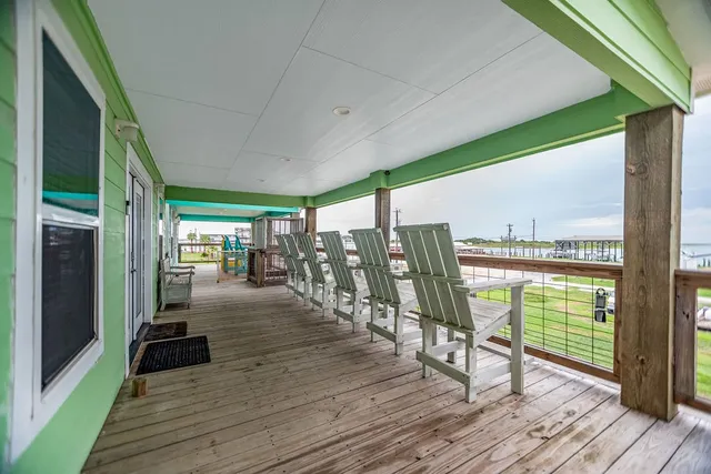 a view of a balcony with chairs