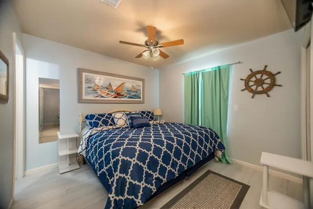 a view of a workspace with furniture and window