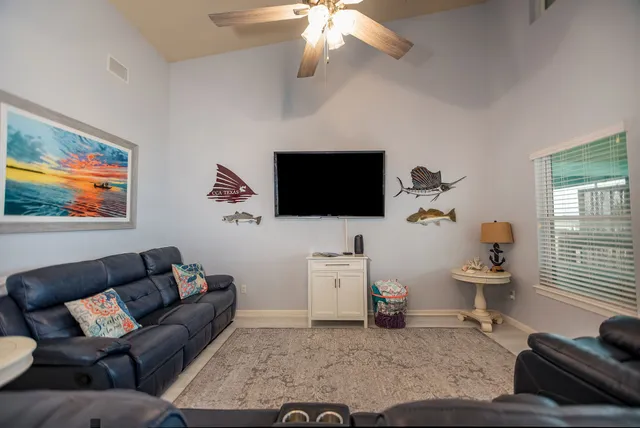 a kitchen with stainless steel appliances granite countertop a kitchen island hardwood floor sink and stove