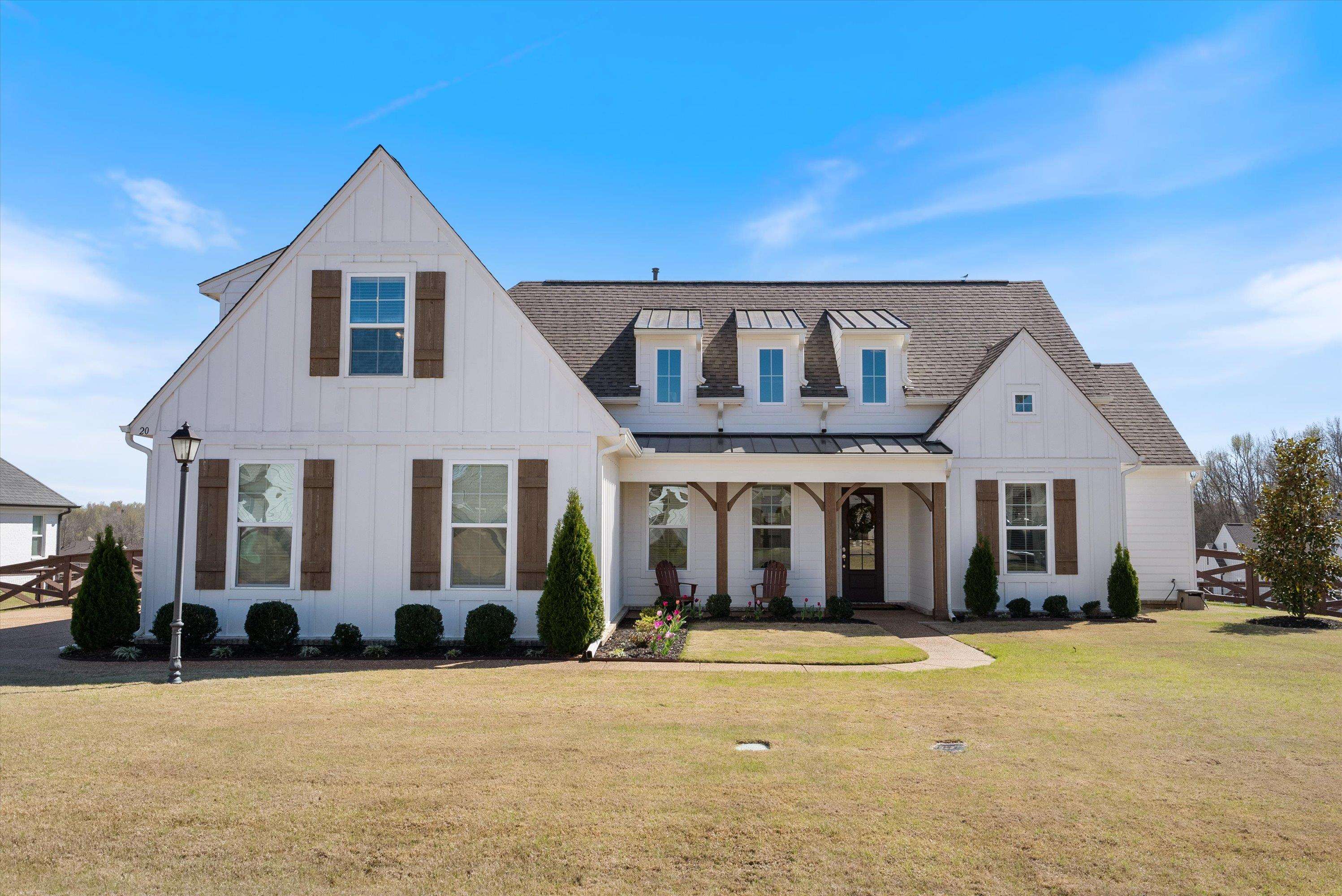 a front view of a house with a yard