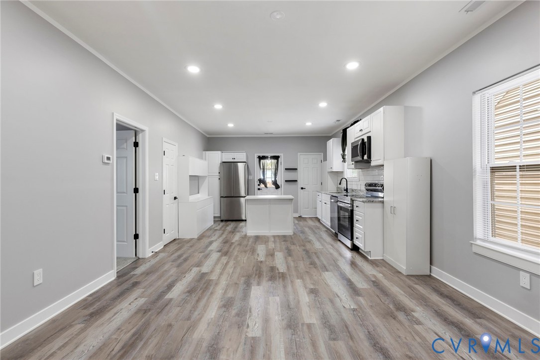 3061 Decatur Street Richmond, VA 23224 - Photo 7 of 23 Kitchen featuring white cabinetry, ornamental mold