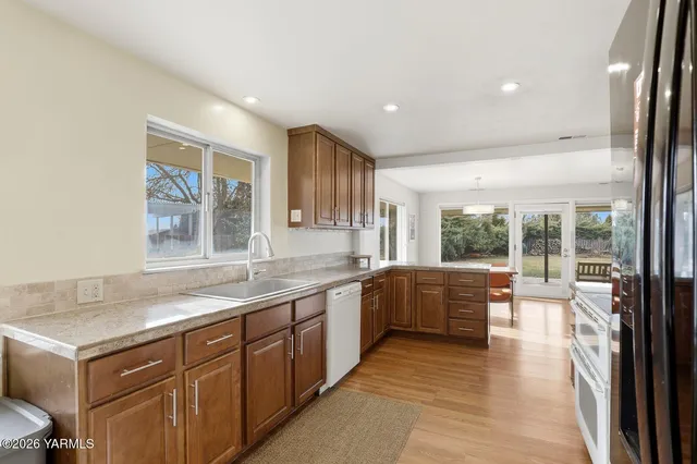 a large kitchen with a large counter top space