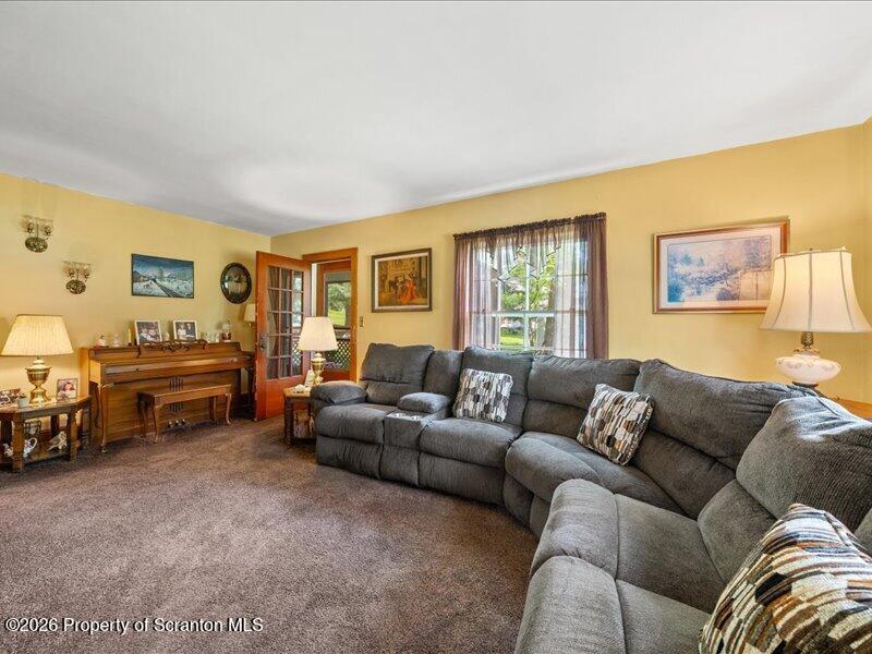 71 Pleasant Avenue Thompson, PA 18465 - Photo 4 of 37 a living room with furniture and a window