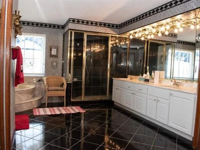 a bathroom with a mirror and a shower