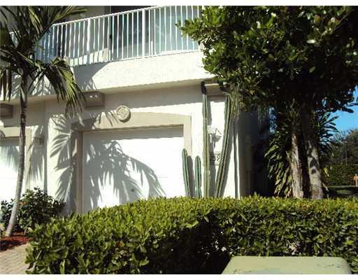 3259 Laurel Ridge Circle Riviera Beach, FL 33404 - Photo 1 of 6 a view of a house with a plants