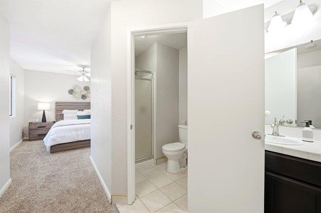 8550 Wren Avenue, Unit 3B Gilroy, CA 95020 - Photo 11 of 27 a en suite bathroom with a sink and a mirror