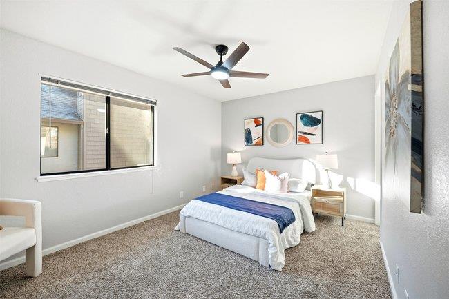 8550 Wren Avenue, Unit 3B Gilroy, CA 95020 - Photo 13 of 27 a bedroom with a bed and a chair