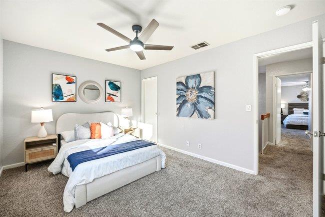 8550 Wren Avenue, Unit 3B Gilroy, CA 95020 - Photo 14 of 27 a bedroom with a bed and a painting on the wall