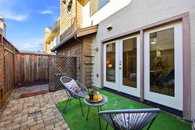 8550 Wren Avenue, Unit 3B Gilroy, CA 95020 - Photo 19 of 27 a view of a chair and table in backyard of the house