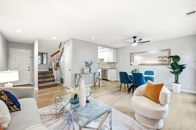 8550 Wren Avenue, Unit 3B Gilroy, CA 95020 - Photo 2 of 27 a living room with furniture and wooden floor
