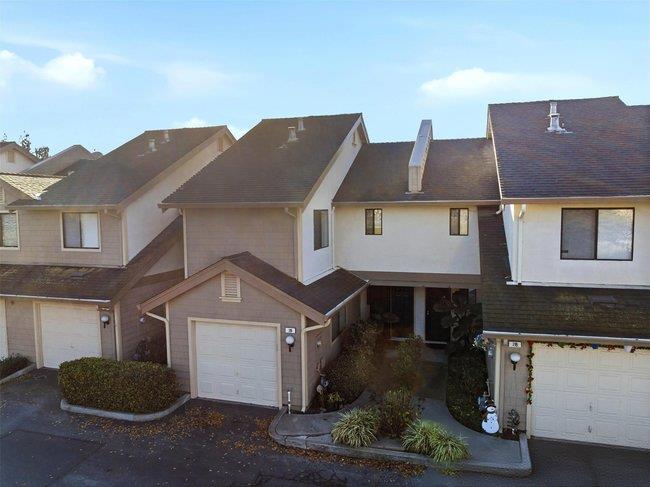 8550 Wren Avenue, Unit 3B Gilroy, CA 95020 - Photo 27 of 27 a front view of a house with a yard and garage