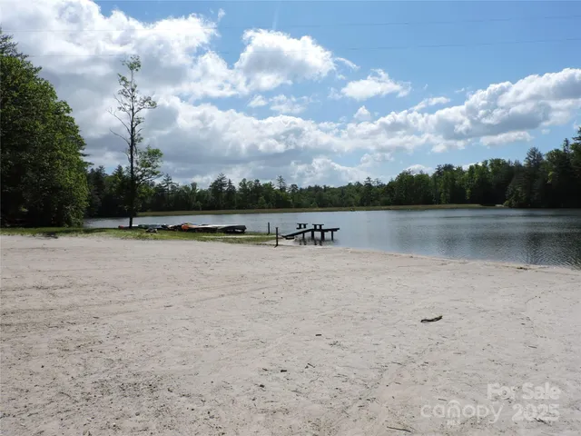 a view of a lake with houses in the back