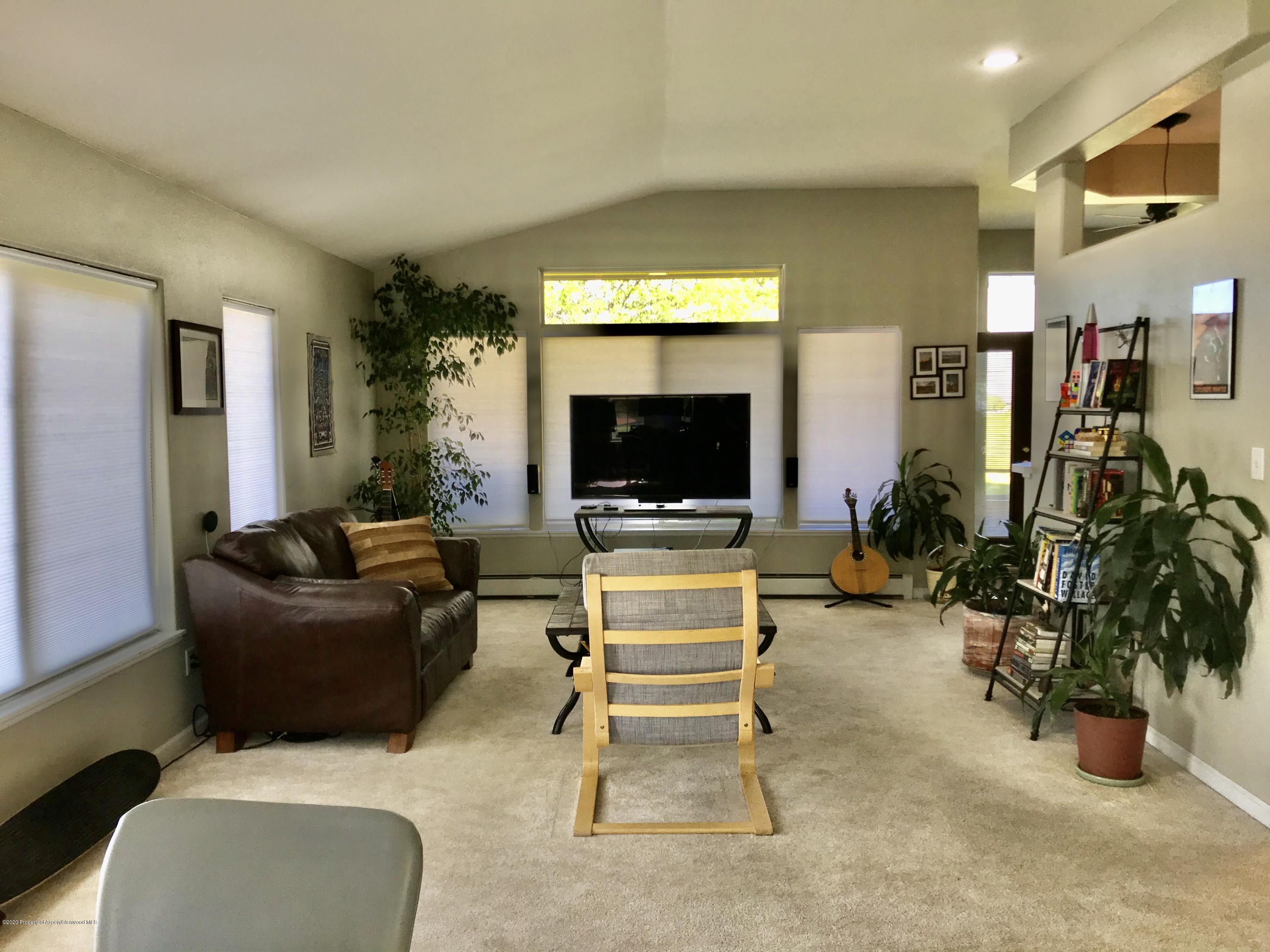 16 Limberpine Circle Parachute, CO 81635 - Photo 11 of 22 a living room with furniture and a flat screen tv