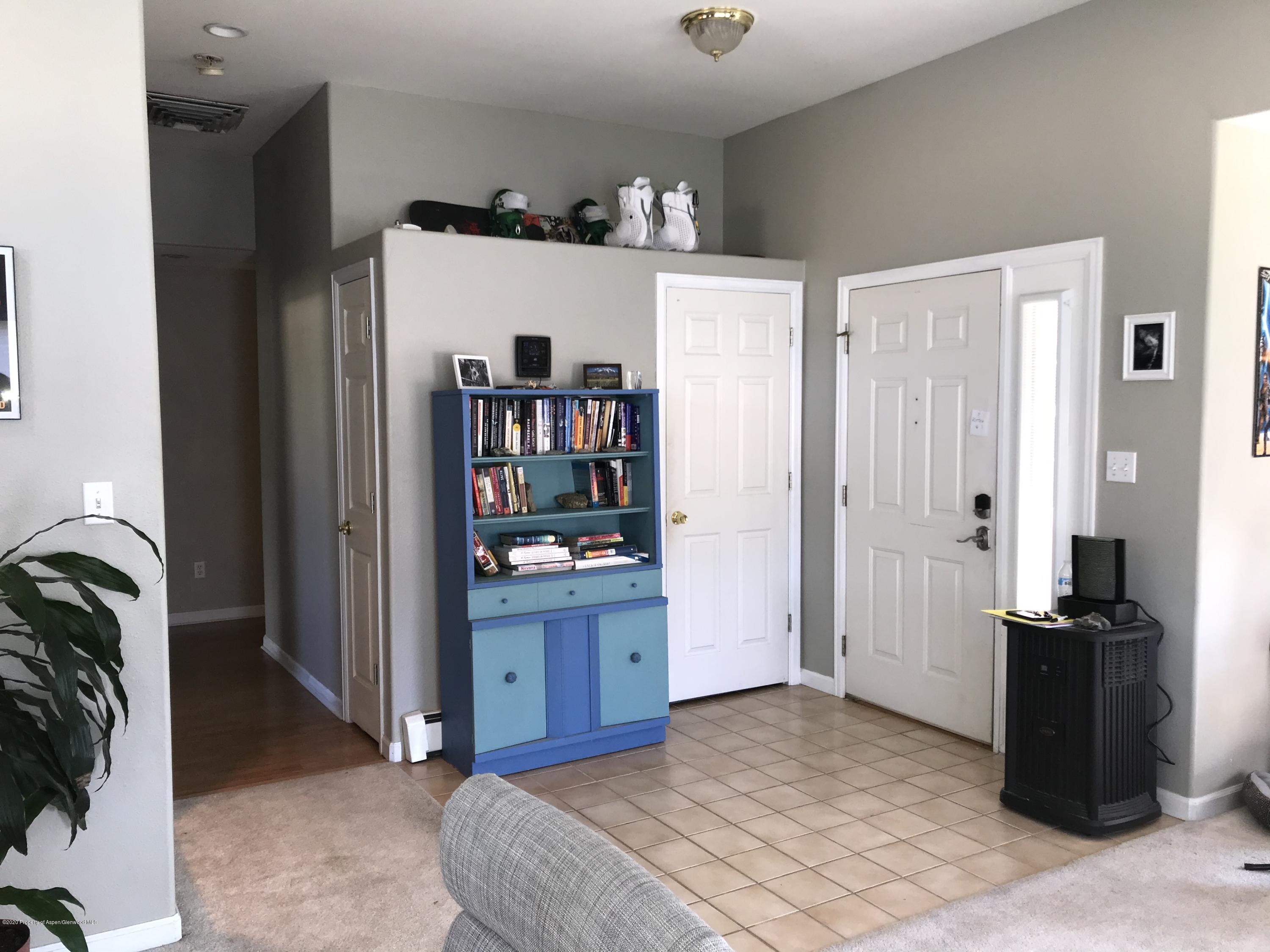 16 Limberpine Circle Parachute, CO 81635 - Photo 12 of 22 a bedroom with a bed and a book shelf in it