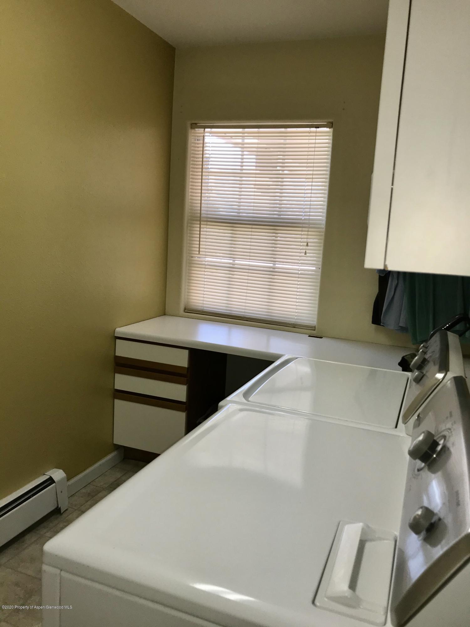 16 Limberpine Circle Parachute, CO 81635 - Photo 20 of 22 a view of storage and utility room with washer and dryer