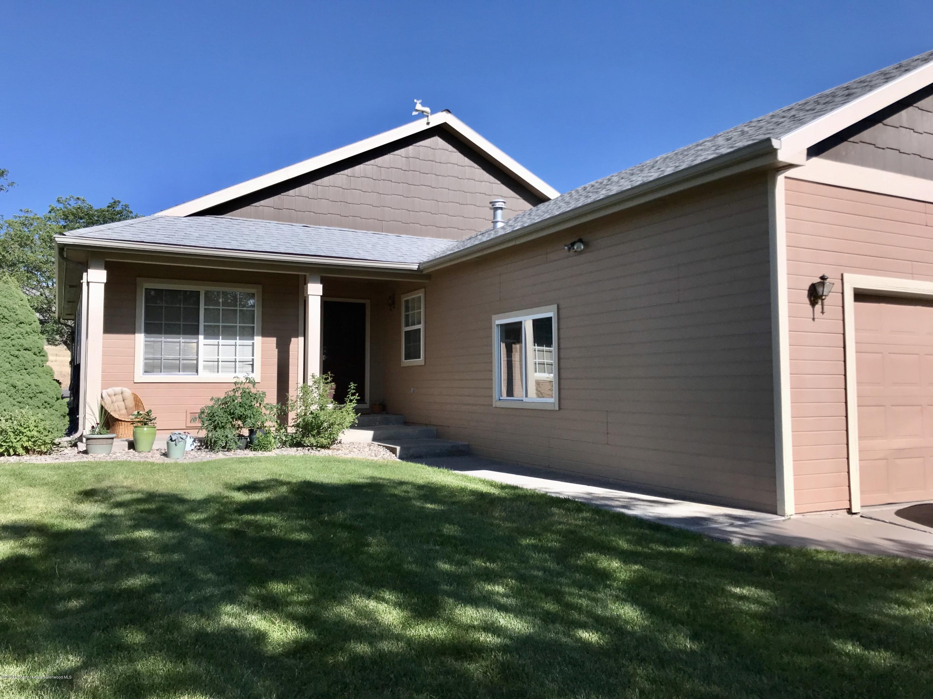 16 Limberpine Circle Parachute, CO 81635 - Photo 2 of 22 a front view of a house with a yard