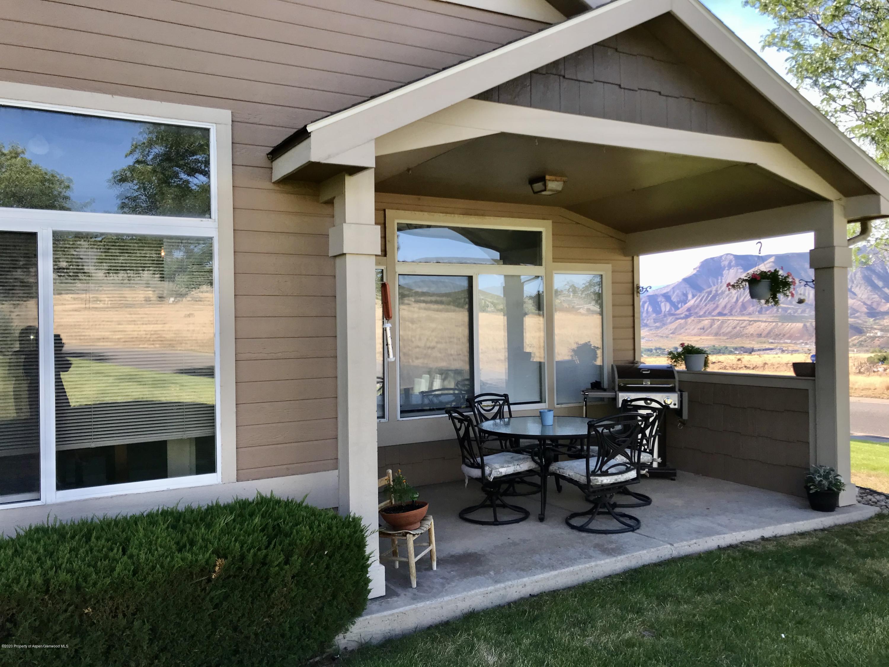 16 Limberpine Circle Parachute, CO 81635 - Photo 21 of 22 a view of a patio with table and chairs and potted plants