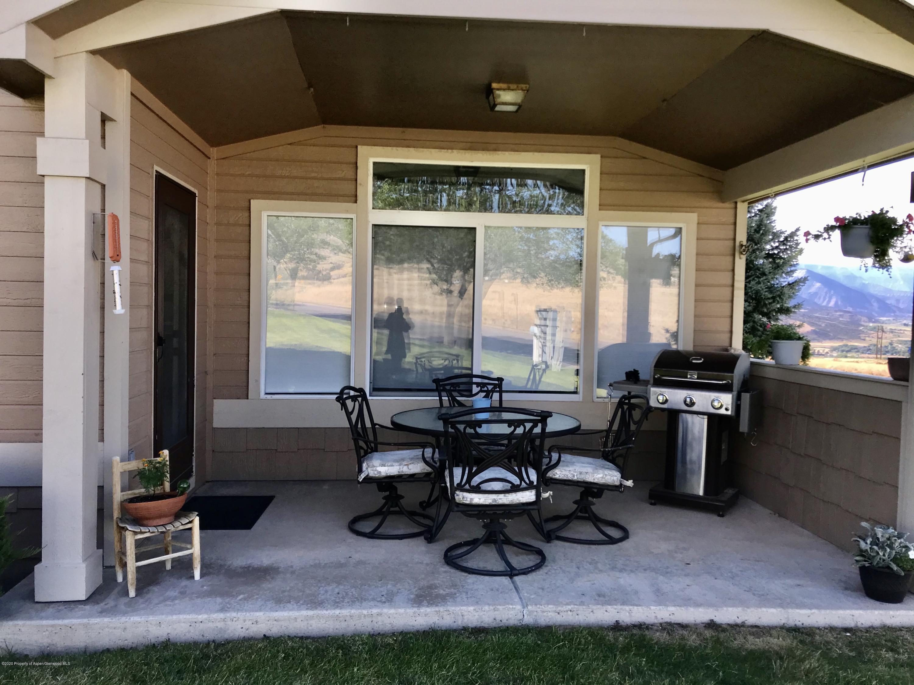 16 Limberpine Circle Parachute, CO 81635 - Photo 22 of 22 a living room with furniture and floor to ceiling window